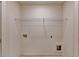 A small laundry room with connections for a washer and dryer at 1569 Aiden Way # 35, Conyers, GA 30013