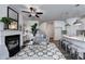 Bright open-concept living room and kitchen with fireplace, modern finishes, and seating at 1569 Aiden Way # 35, Conyers, GA 30013