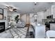 Open-concept living space with stylish kitchen, cozy seating area, fireplace, and modern decor at 1569 Aiden Way # 35, Conyers, GA 30013