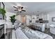 Open concept living room and kitchen with modern furnishings, staircase, and fireplace at 1569 Aiden Way # 35, Conyers, GA 30013