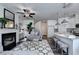 Open-concept living room and kitchen with modern finishes and a breakfast bar at 1569 Aiden Way # 35, Conyers, GA 30013