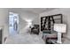 Comfortable living area with neutral tones, plush armchairs, and modern shelving at 1569 Aiden Way # 35, Conyers, GA 30013