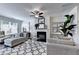 Inviting living room with comfortable seating, fireplace, and natural light at 1569 Aiden Way # 35, Conyers, GA 30013