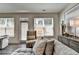 Bright living room with chaise lounge, accent chair, and lots of natural light at 1569 Aiden Way # 35, Conyers, GA 30013