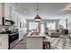 Open concept living space with kitchen, dining area, living room, and neutral decor at 1569 Aiden Way # 35, Conyers, GA 30013