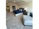 The main bedroom has neutral carpeting, a navy bed set, and a grey dresser at 1569 Aiden Way # 35, Conyers, GA 30013