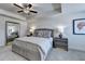 Well lit bedroom with tray ceiling, carpet and large mirror at 1569 Aiden Way # 35, Conyers, GA 30013
