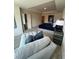 Carpeted main bedroom featuring a cushioned sitting area and a navy bed set at 1569 Aiden Way # 35, Conyers, GA 30013