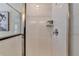 Elegant white tiled shower with chrome hardware and built-in shelf at 1569 Aiden Way # 35, Conyers, GA 30013
