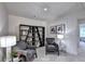 Comfortable sitting area with two gray chairs, bookshelves, and ambient lighting at 1569 Aiden Way # 35, Conyers, GA 30013