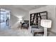 Comfortable sitting area with two gray chairs, bookshelves, and ambient lighting at 1569 Aiden Way # 35, Conyers, GA 30013