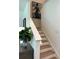 Well-lit staircase with modern decor and stylish details at 1569 Aiden Way # 35, Conyers, GA 30013