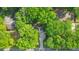 Aerial view of a home nestled among lush, mature trees, showcasing its private and serene setting at 1584 Allgood Ne Rd, Marietta, GA 30062