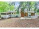 Backyard featuring a screened in porch and brick chimney at 1584 Allgood Ne Rd, Marietta, GA 30062
