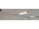 Unfinished basement with fluorescent lighting and a white wall at 1584 Allgood Ne Rd, Marietta, GA 30062