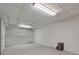 Spacious unfinished basement with white walls, lighting, and concrete floors at 1584 Allgood Ne Rd, Marietta, GA 30062