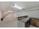 Unfinished basement featuring a bar area, cabinets, and an adjacent staircase at 1584 Allgood Ne Rd, Marietta, GA 30062