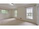 Carpeted bedroom with bright windows and natural light offers a serene and inviting space at 1584 Allgood Ne Rd, Marietta, GA 30062