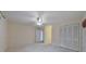 This bedroom offers neutral carpet, double closets, and access to other rooms at 1584 Allgood Ne Rd, Marietta, GA 30062