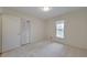 Neutral bedroom featuring carpet, natural light, and a closet at 1584 Allgood Ne Rd, Marietta, GA 30062