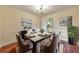 Elegant dining room featuring modern decor, hardwood flooring, and a decorative chandelier at 1584 Allgood Ne Rd, Marietta, GA 30062