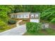 Front exterior view of a brick home with brick accents and a yard at 1584 Allgood Ne Rd, Marietta, GA 30062