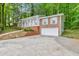 Front exterior view of a brick home and driveway at 1584 Allgood Ne Rd, Marietta, GA 30062