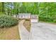 Charming single-story brick home featuring a well-manicured front yard, and a two-car attached garage at 1584 Allgood Ne Rd, Marietta, GA 30062