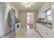 Bright kitchen with white cabinets, stainless steel appliances, and backyard views at 1584 Allgood Ne Rd, Marietta, GA 30062