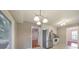 Eat-in kitchen features stainless steel refrigerator, backyard views, and access to living areas at 1584 Allgood Ne Rd, Marietta, GA 30062