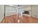 Open living room with hardwood floors, brick fireplace, and built-in shelving at 1584 Allgood Ne Rd, Marietta, GA 30062