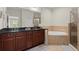Luxurious bathroom with a soaking tub, double vanity, and a separate shower at 3708 Ashford Creek Ne Hl # 3708, Atlanta, GA 30319