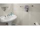 Half bathroom with white pedestal sink, chrome faucet, round mirror, and towel bar at 3708 Ashford Creek Ne Hl # 3708, Atlanta, GA 30319