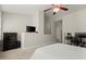 Bright bedroom with a ceiling fan, carpeted floors, and a dedicated workspace at 3708 Ashford Creek Ne Hl # 3708, Atlanta, GA 30319