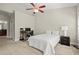 Spacious bedroom featuring plush carpeting, a ceiling fan, and ample workspace at 3708 Ashford Creek Ne Hl # 3708, Atlanta, GA 30319