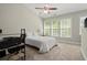 Serene bedroom with natural light, neutral colors, and a ceiling fan at 3708 Ashford Creek Ne Hl # 3708, Atlanta, GA 30319
