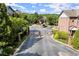Gated community entrance with landscaping and views of surrounding townhomes and clubhouse at 3708 Ashford Creek Ne Hl # 3708, Atlanta, GA 30319