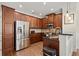 Open kitchen featuring granite countertops, stainless steel appliances, and wood floors at 3708 Ashford Creek Ne Hl # 3708, Atlanta, GA 30319