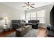 Bright living room with hardwood floors, neutral tones, and a ceiling fan at 3708 Ashford Creek Ne Hl # 3708, Atlanta, GA 30319