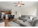 Open-concept living room with hardwood floors, ceiling fan and comfortable furniture at 3708 Ashford Creek Ne Hl # 3708, Atlanta, GA 30319