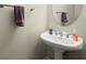 Elegant powder room with a pedestal sink and neutral color scheme at 3708 Ashford Creek Ne Hl # 3708, Atlanta, GA 30319