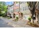 Attractive townhome neighborhood with private garages, well-maintained lawns, and brick accents at 3708 Ashford Creek Ne Hl # 3708, Atlanta, GA 30319