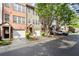Charming townhome community with individual garages, manicured landscaping, and brick facade at 3708 Ashford Creek Ne Hl # 3708, Atlanta, GA 30319
