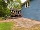 Backyard deck with stone patio, grill, and comfortable seating, perfect for gatherings at 5364 Muirwood Pl, Powder Springs, GA 30127