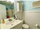 Well-lit bathroom features white wainscoting, updated fixtures and decorative accents at 5364 Muirwood Pl, Powder Springs, GA 30127