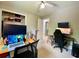 Bedroom featuring two work areas with updated ceiling fan and a carpeted floor at 5364 Muirwood Pl, Powder Springs, GA 30127