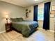 Calm bedroom with hardwood floors featuring neutral colors and a natural light from the window at 5364 Muirwood Pl, Powder Springs, GA 30127