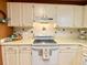 Well-maintained kitchen boasting white appliances and ample counter space at 5364 Muirwood Pl, Powder Springs, GA 30127