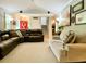 Open concept living room with fireplace, vaulted ceilings, comfortable seating, and natural light, great for entertaining at 5364 Muirwood Pl, Powder Springs, GA 30127