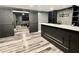 Finished basement featuring sliding barn doors, wet bar and entertainment area, ideal for relaxing at 626 Discovery Ct, Acworth, GA 30102